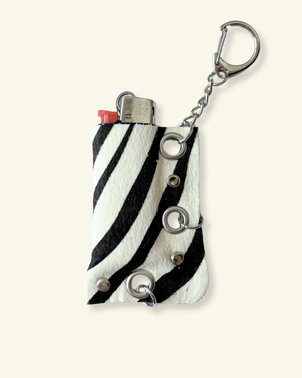 PORTE-BRIQUET [ZEBRA] - OEILLETS