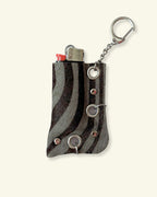 PORTE-BRIQUET [DARK ZEBRA] - OEILLETS