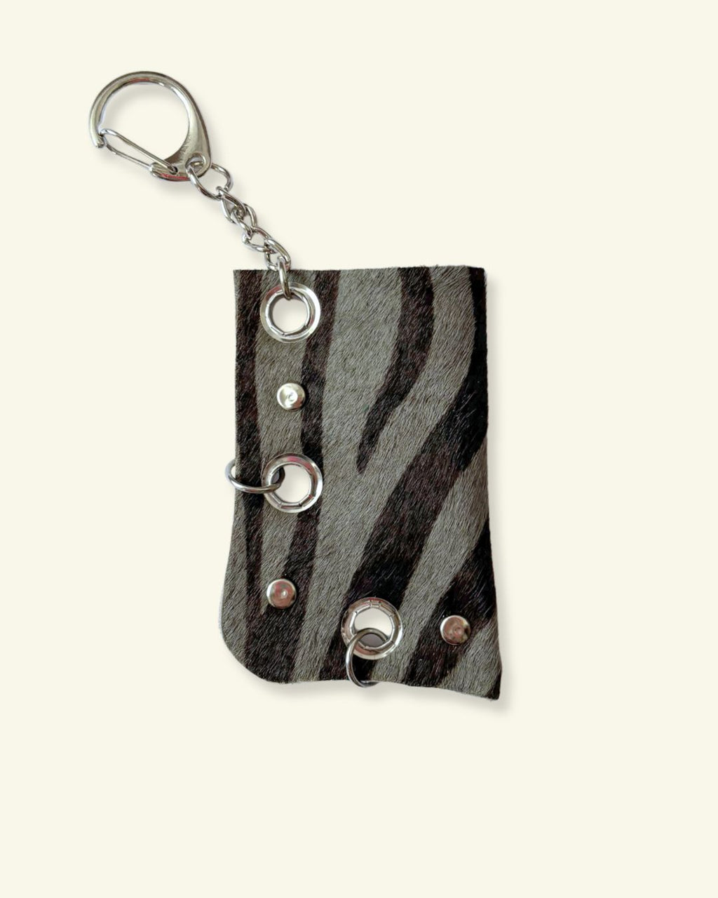 PORTE-BRIQUET [DARK ZEBRA] - OEILLETS