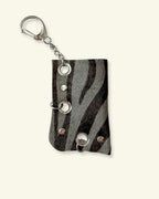 PORTE-BRIQUET [DARK ZEBRA] - OEILLETS